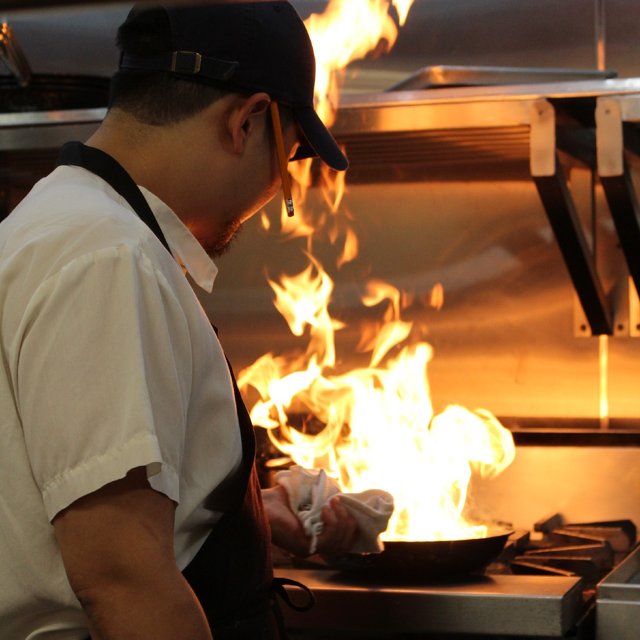 A glimpse at our kitchen where flaming creations take center …