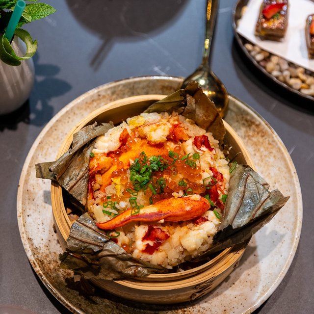 Hot off the wok, the lobster rice finishes cooking in …