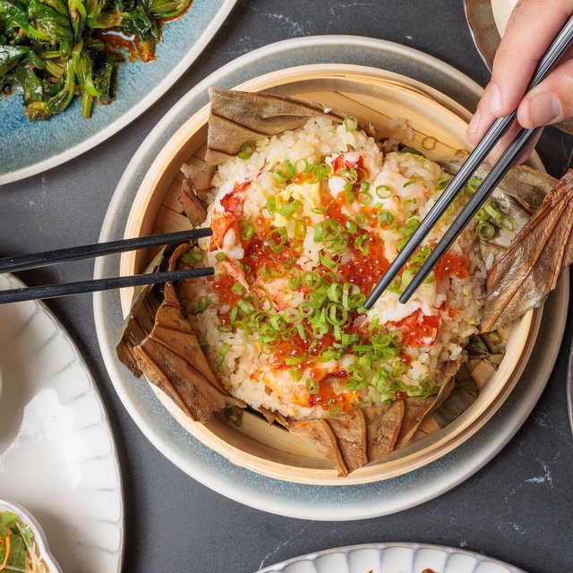 Fragrant lobster rice, wrapped in lotus leaf and crowned with …
